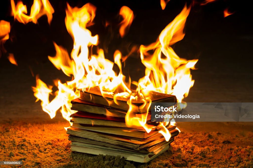 Stack of books burning Book Stock Photo