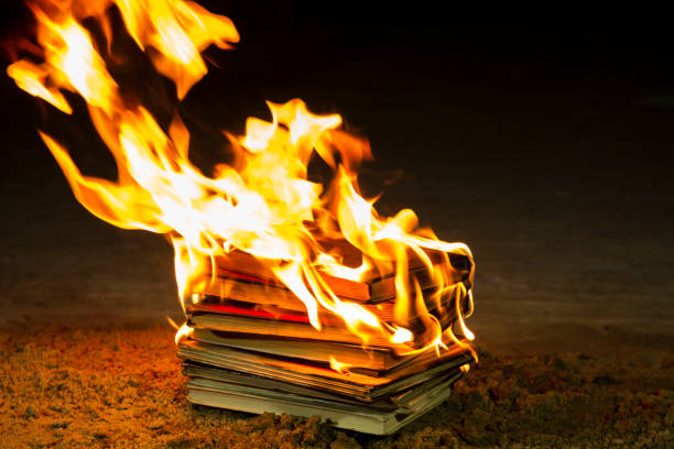 Stack of books burning stock photo