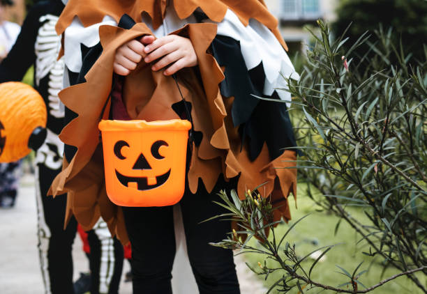 istock Young kids trick or treating during Halloween 1035609012