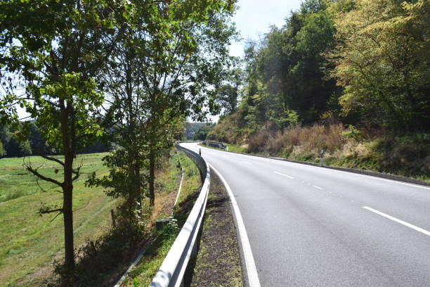 istock lake road at Laacher See 1035619218