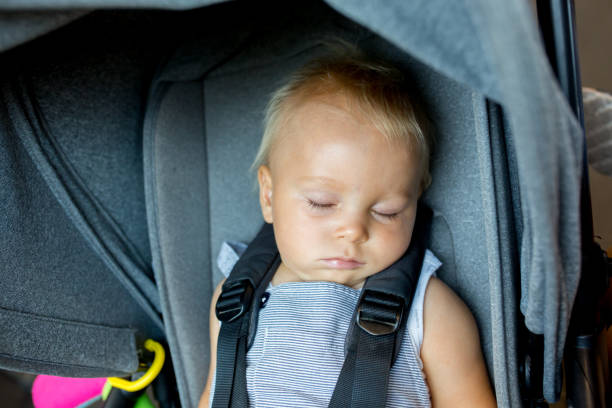istock Healthy Baby boy is sleeping in stroller 1035619602