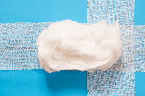 medical cotton wool on a blue background