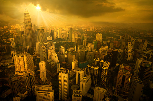 sky view of kuala lumpur city during a stormy sunset, all visible logos are removed