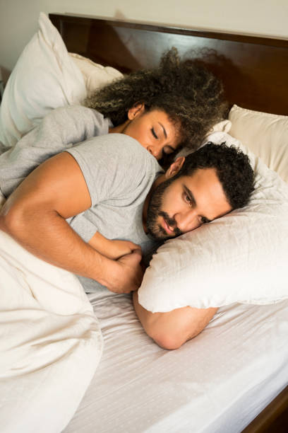 istock Couple lying on the bed 1035630190
