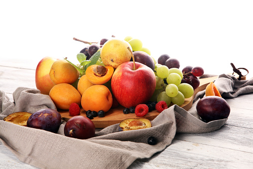 Close-up of plums in glass bowl