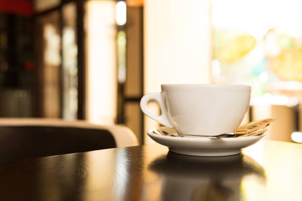 White cup and saucer on the table