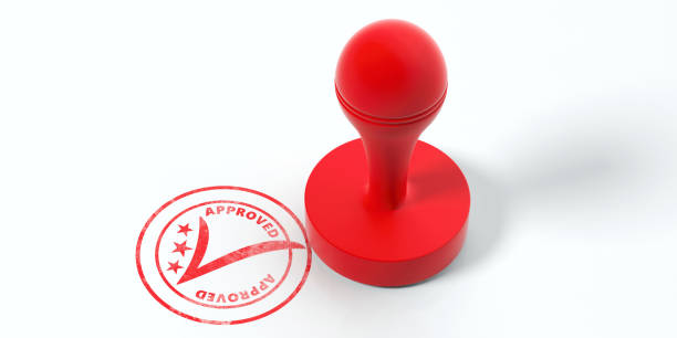 istock Red round rubber stamper and stamp with text approved isolated on white background. 3d illustration 1035632006