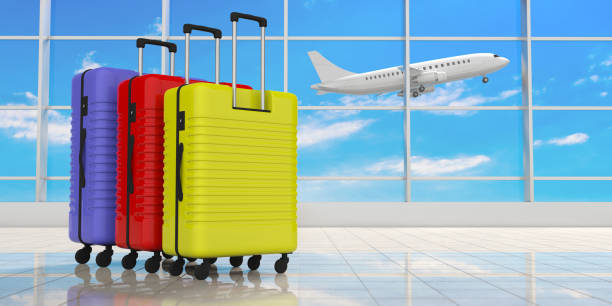 istock Three bright colors suitcases on airport terminal background. 3d illustration 1035632078