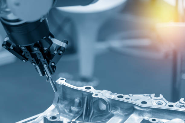 istock The robotic arm catch the steel plug for manufacturing   process . 1035646476