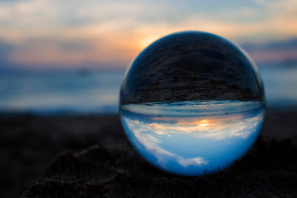 istock Blue and Orange Beach Sunset Captured in Glass Ball 1035646838