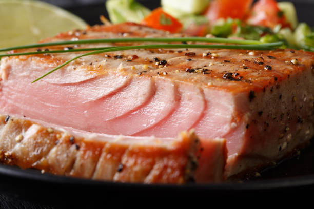 istock Grilled tuna steak with pepper macro. horizontal 1035653686