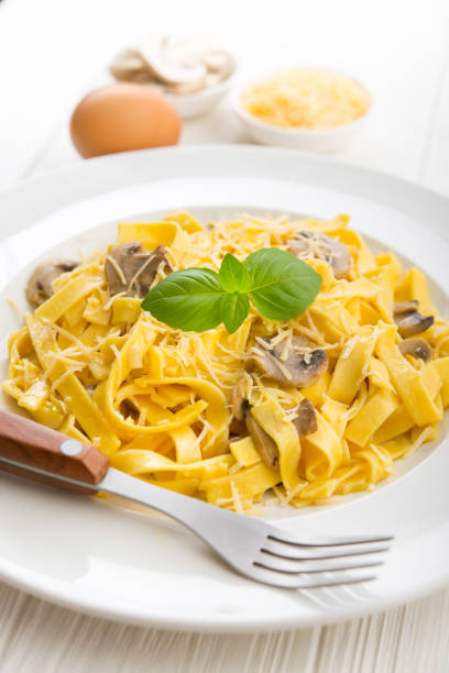istock Tagliatelle pasta with cheese and mushrooms 1035654048