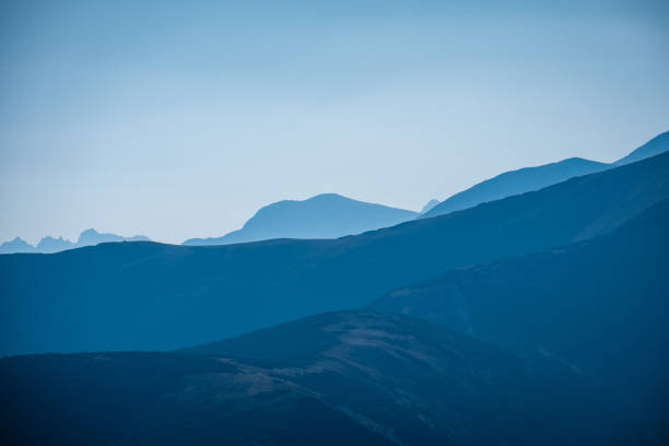 istock mountain top panorama in  autumn covered in mist or clouds 1035654284