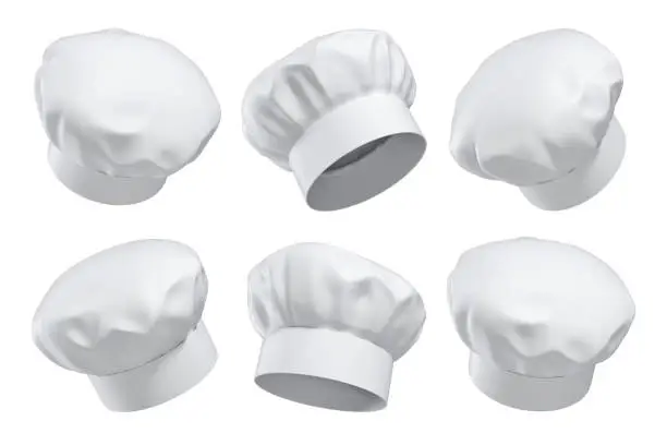 Photo of 3d rendering of six white chef's hats isolated on a white background in different angles.