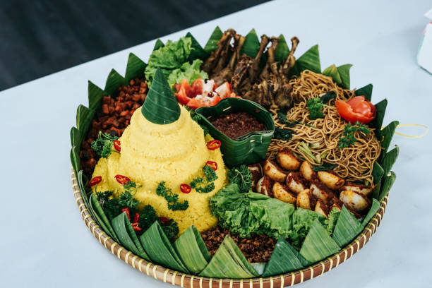 tumpeng rice or yellow rice or nasi kuning or nasi lemak - tumpeng potret stok, foto, & gambar bebas royalti