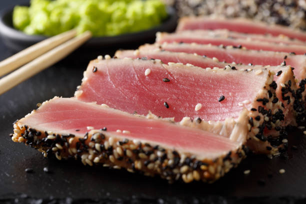 istock beautiful food: sliced tuna steak with sesame macro. horizontal 1035658922