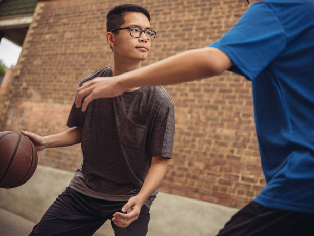 istock Twins at basketball 1035659332