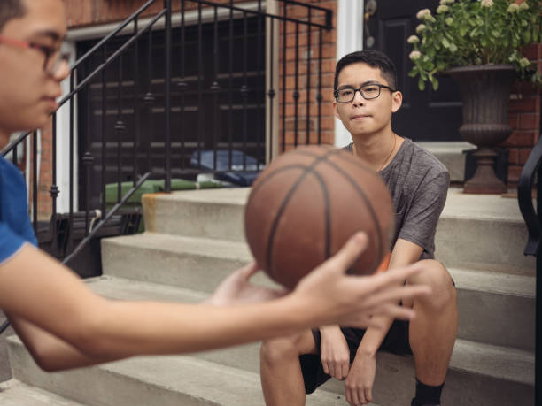 istock Twins at basketball 1035659560