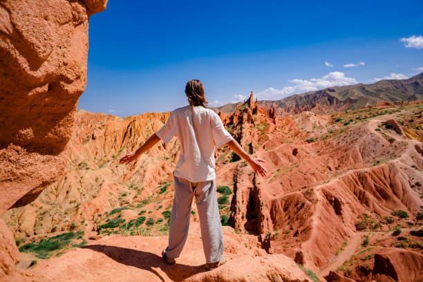 istock the guy stands in the mountains 1035659640