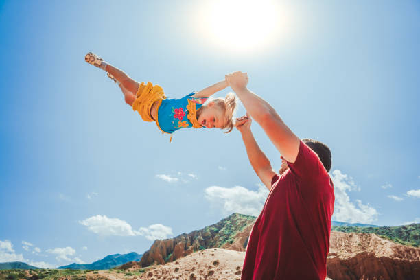 istock dad picks up the child 1035659658