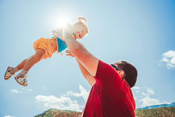istock dad picks up the child 1035659702