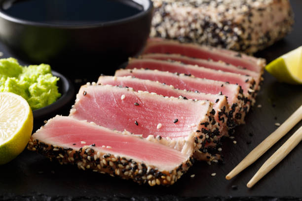istock Seared ahi tuna with sesame seeds and soy sauce, wasabi, lime macro. horizontal 1035659802