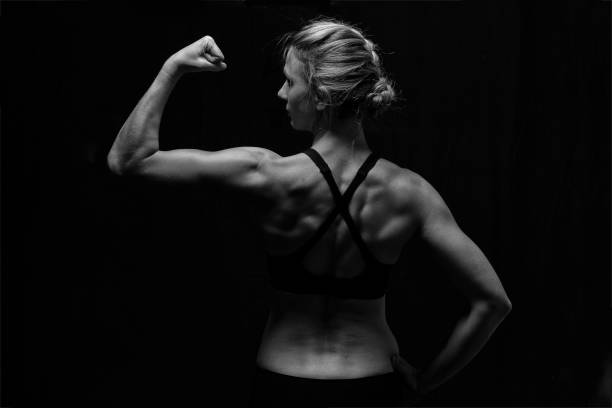 istock Fit woman with shaped muscles on her back in artistic conversion 1035663406