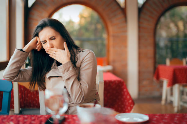 istock Sleepy Woman Yawning while Waiting In a Restaurant 1035663484