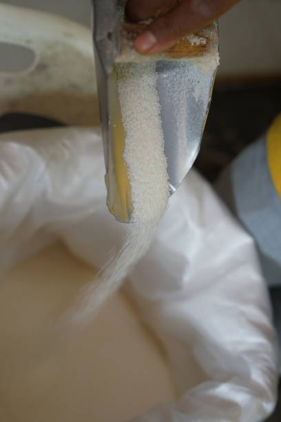 istock Spilling Sugar granules with scoop in bag 1035667996
