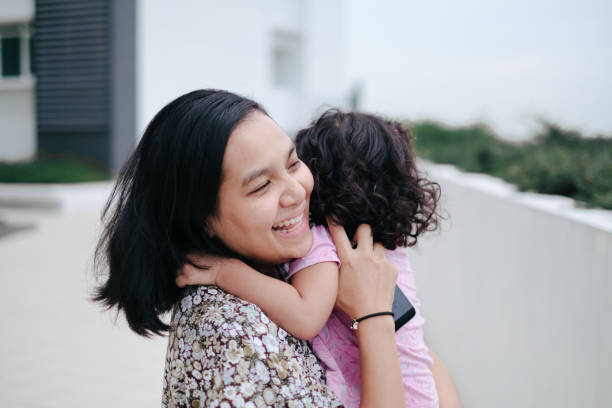 istock mom and daughter portrait 1035675744