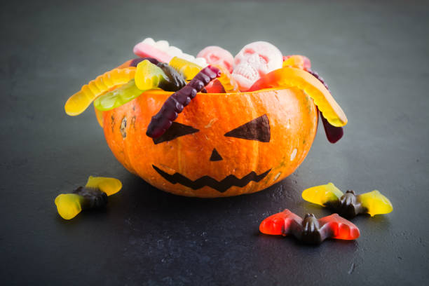 istock Natural pumpkin Jack with Halloween different candies 1035679062