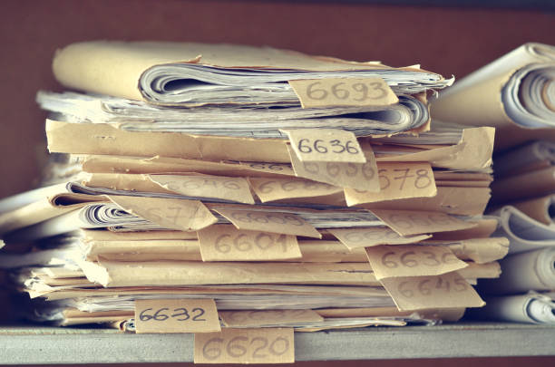 istock Old documents, drawings with numbers stacked on shelves in the office 1035679678