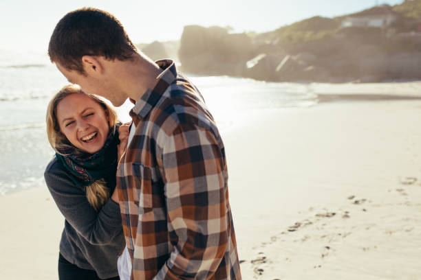 istock Loving couple having a great time at the beach 1035679788
