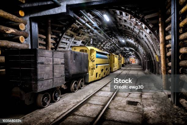 Coal Mine Underground Corridor With Freight Railroad Cars Stock Photo - Download Image Now