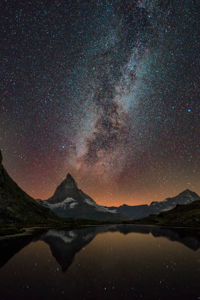 istock Matterhorn reflected in Riffelsee Lake under the Stars 1035683694