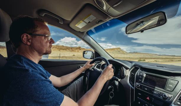 istock Traveler driving thru desert 1035683786