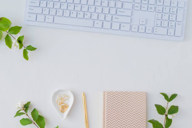 istock Flat lay desk and branch with green leaves 1035688940