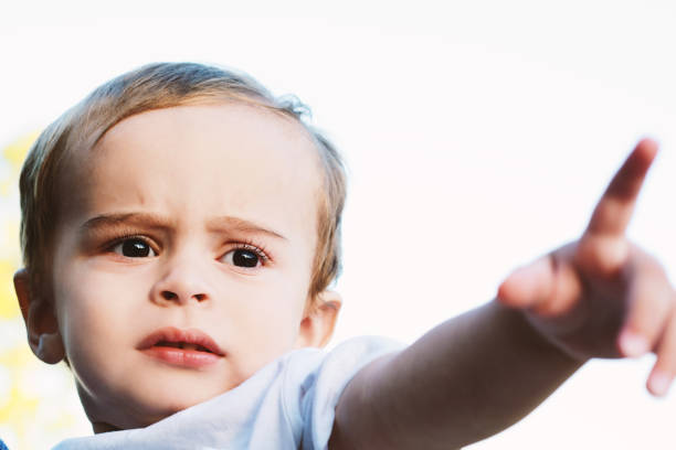 istock Cute one year old baby boy on the park 1035693394