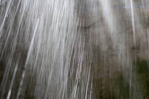 istock High speed gosta rain detail, fall, irrigation, wall background. 1035704994