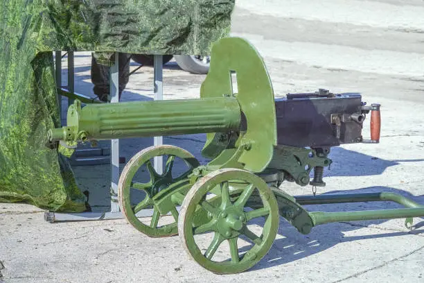 Old machine gun green color Maxim system