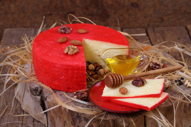 istock Still life with cheese, honey and nuts on a wooden table 1035725054