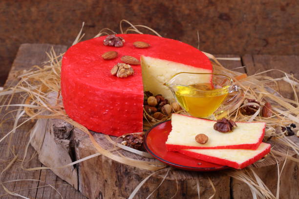 istock Still life with cheese, honey and nuts on a wooden table 1035725070