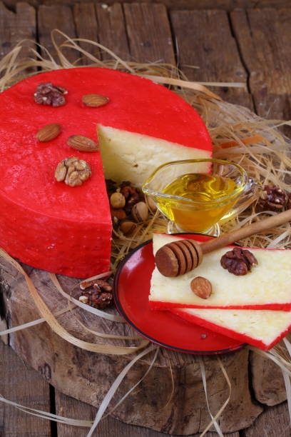 istock Still life with cheese, honey and nuts on a wooden table 1035725168