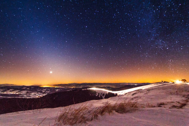 Sunset and stars at dusk in Carpathian mountain range. Ukraine.