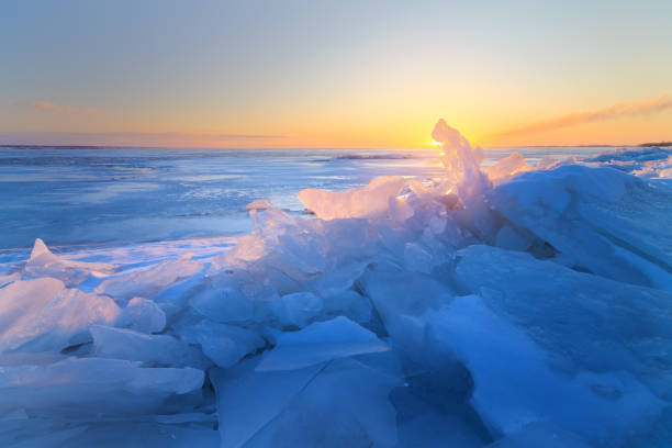 istock dawn at the frozen lake shore 1035730168
