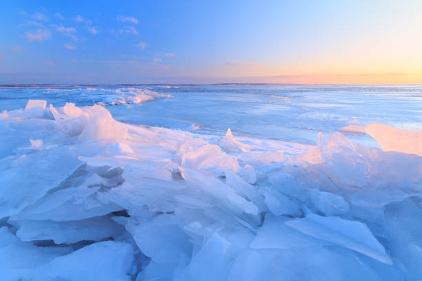 istock dawn at the frozen lake shore 1035730170