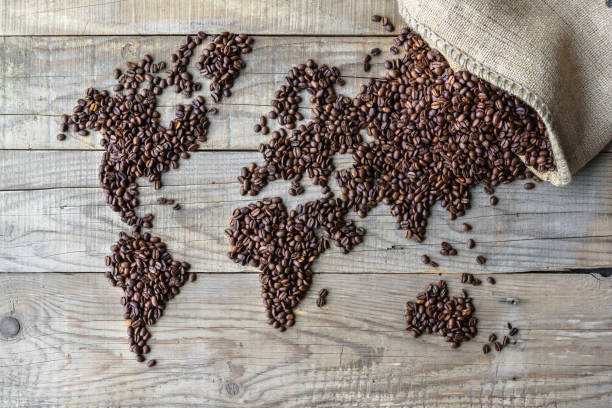 istock World of Coffee - fresh roasted coffee beans conceptual background 1035739924
