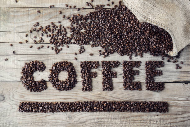 istock Fresh roasted coffee beans on rustic wood background 1035739926