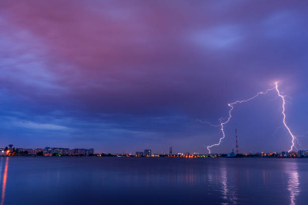 istock Lightning thunderbolt striking avove the city 1035742856