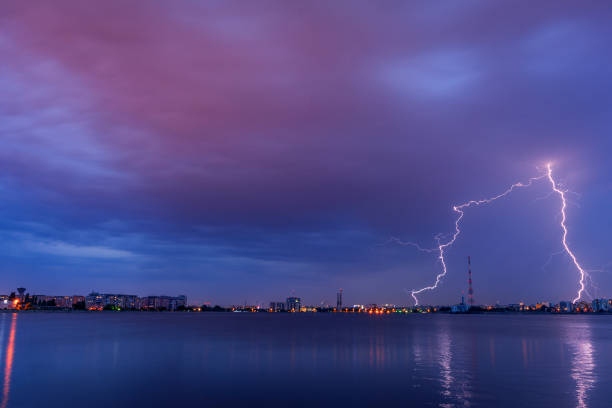 Lightning thunderbolt striking avove the city stock photo